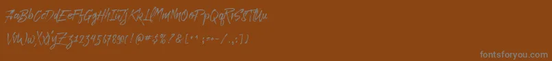 フォントParadise Typeface Free Demo – 茶色の背景に灰色の文字