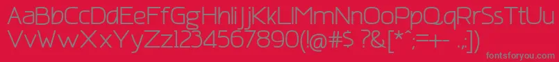 AmatracaGrotesqueNormal-Schriftart – Graue Schriften auf rotem Hintergrund