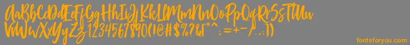 フォントPassengers Script – オレンジの文字は灰色の背景にあります。