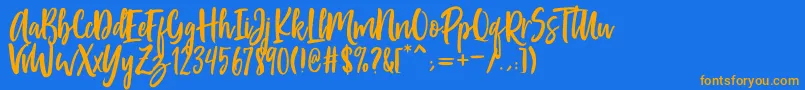 フォントPassengers Script – オレンジ色の文字が青い背景にあります。