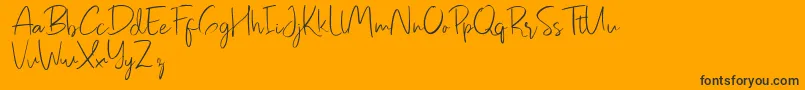 Pastelyn-Schriftart – Schwarze Schriften auf orangefarbenem Hintergrund