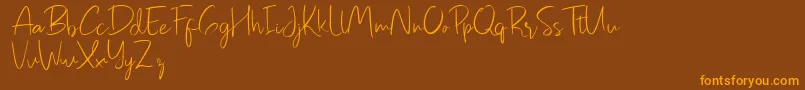 Pastelyn-Schriftart – Orangefarbene Schriften auf braunem Hintergrund