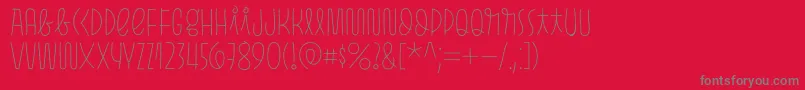 Pasto Print Thin-Schriftart – Graue Schriften auf rotem Hintergrund
