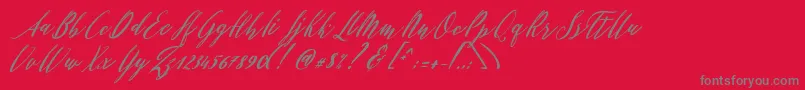 Fonte Patricia Script – fontes cinzas em um fundo vermelho