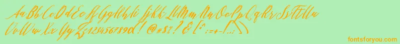 Czcionka Patricia Script – pomarańczowe czcionki na zielonym tle