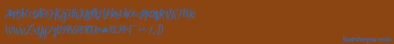 Patronia Script-Schriftart – Blaue Schriften auf braunem Hintergrund