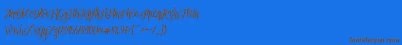 Patronia Script-Schriftart – Braune Schriften auf blauem Hintergrund