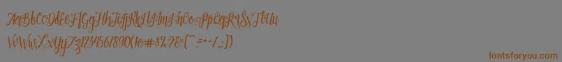 Patronia Script Font – Brown Fonts on Gray Background
