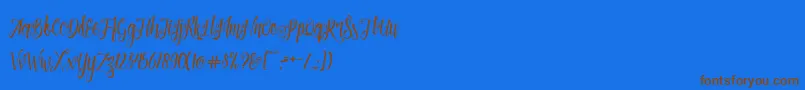 Patronia Script-Schriftart – Braune Schriften auf blauem Hintergrund