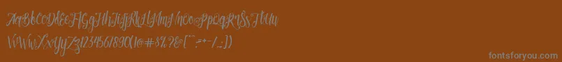 Patronia Script Font – Gray Fonts on Brown Background