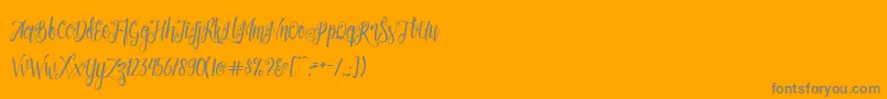 Patronia Script Font – Gray Fonts on Orange Background