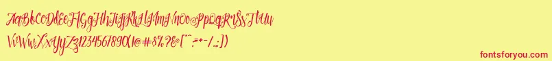 Patronia Script-Schriftart – Rote Schriften auf gelbem Hintergrund