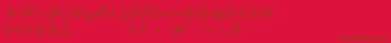 pauline script-Schriftart – Braune Schriften auf rotem Hintergrund