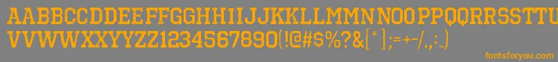 フォントOctinvintagebrgBold – オレンジの文字は灰色の背景にあります。