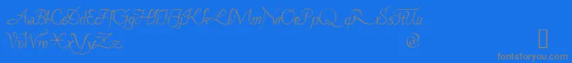 PAVANE  -Schriftart – Graue Schriften auf blauem Hintergrund