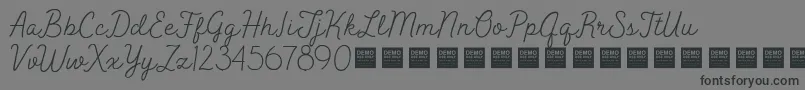 Шрифт Peak Times   Demo – чёрные шрифты на сером фоне