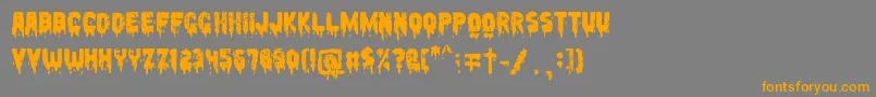 フォントPeccatum – オレンジの文字は灰色の背景にあります。