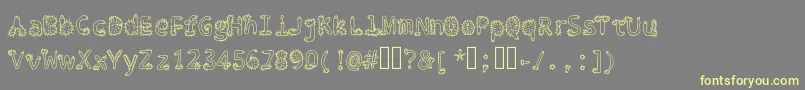 Penis Typography Regular Font – Yellow Fonts on Gray Background