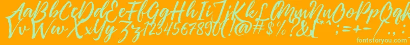 Pennelo Free Demo-Schriftart – Grüne Schriften auf orangefarbenem Hintergrund