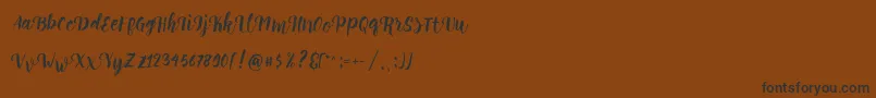 Perrota Script Free Demo Font – Black Fonts on Brown Background