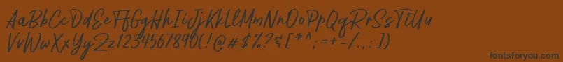 Шрифт Pestapora Free – чёрные шрифты на коричневом фоне