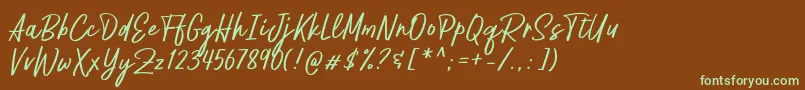 フォントPestapora Free – 緑色の文字が茶色の背景にあります。