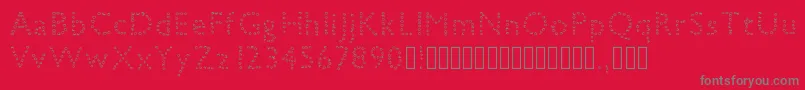 フォントpetiteboule – 赤い背景に灰色の文字