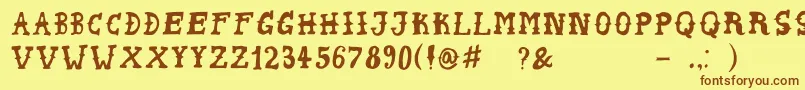 フォントPeyoteHandwrite – 茶色の文字が黄色の背景にあります。