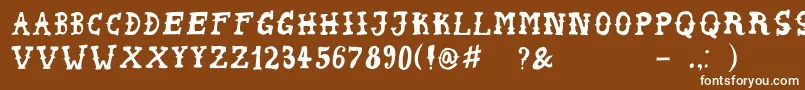 PeyoteHandwrite-fontti – valkoiset fontit ruskealla taustalla