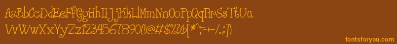 フォントPHANRG   – オレンジ色の文字が茶色の背景にあります。