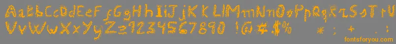 フォントUroboros – オレンジの文字は灰色の背景にあります。