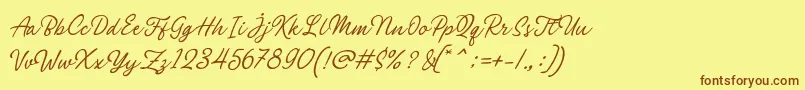 Philomena Script-fontti – ruskeat fontit keltaisella taustalla