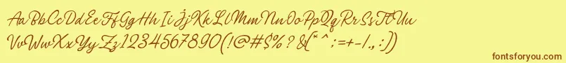 Fonte Philomena Script – fontes marrons em um fundo amarelo