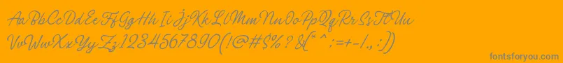 Czcionka Philomena Script – szare czcionki na pomarańczowym tle