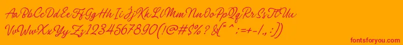 Philomena Script-Schriftart – Rote Schriften auf orangefarbenem Hintergrund