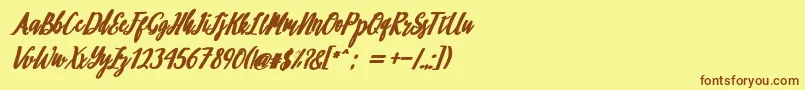 フォントphilosophy – 茶色の文字が黄色の背景にあります。