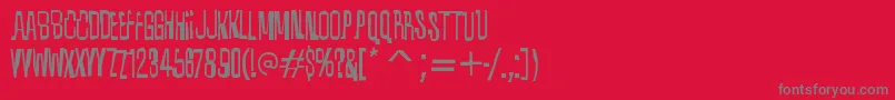 フォントQuixoticRegular – 赤い背景に灰色の文字