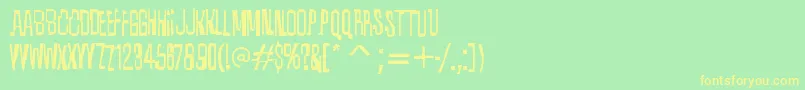 フォントQuixoticRegular – 黄色の文字が緑の背景にあります