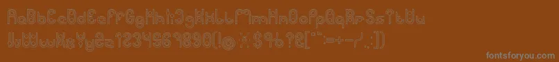 Więcej informacji o czcionce PHYTOPLANKTON Hollow Czcionka PHYTOPLANKTON Hollow – szare czcionki na brązowym tle