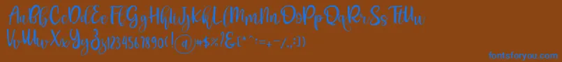 Pichellya Script-fontti – siniset fontit ruskealla taustalla