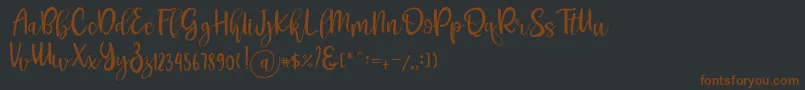Fonte Pichellya Script – fontes marrons em um fundo preto
