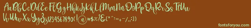 フォントPichellya Script – 緑色の文字が茶色の背景にあります。