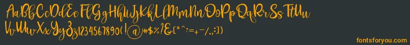 フォントPichellya Script – 黒い背景にオレンジの文字