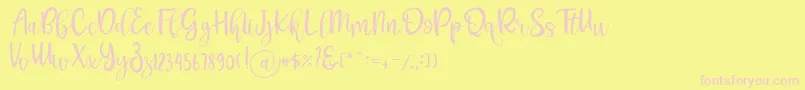 フォントPichellya Script – ピンクのフォント、黄色の背景