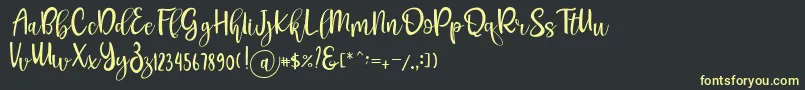 Шрифт Pichellya Script – жёлтые шрифты на чёрном фоне