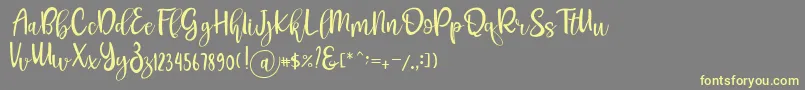 Шрифт Pichellya Script – жёлтые шрифты на сером фоне