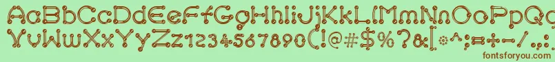 pierced chrom-Schriftart – Braune Schriften auf grünem Hintergrund