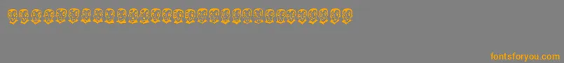 フォントPierretheVampire – オレンジの文字は灰色の背景にあります。