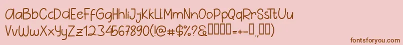 フォントPig Year Sans – ピンクの背景に茶色のフォント
