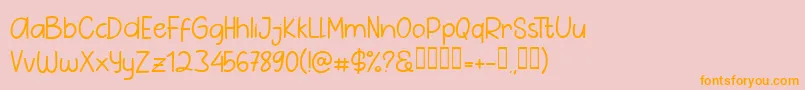 フォントPig Year Sans – オレンジの文字がピンクの背景にあります。